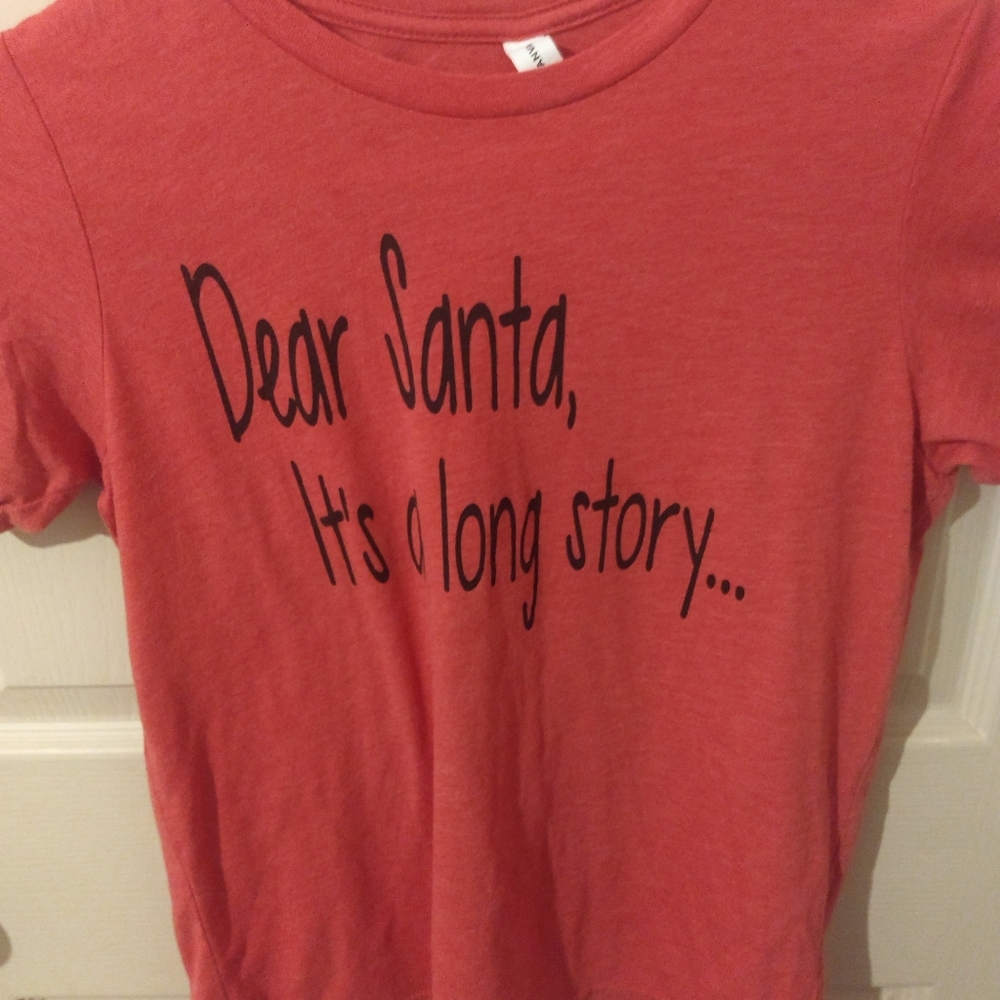 red tee that says "dear santa, it's a long story"